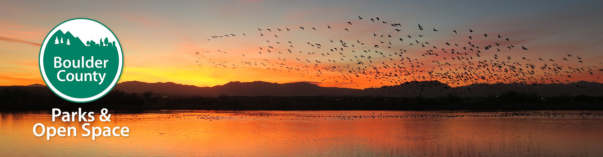 Boulder County Parks & Open Space logo over a sunset
